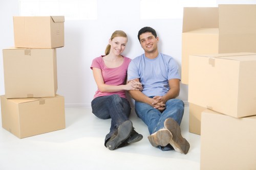 Local movers handling furniture in a residential street