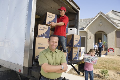 Local moving team handling boxes and furniture in Herne Hill
