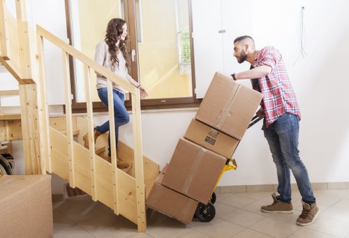 Careful loading of household items into a moving truck